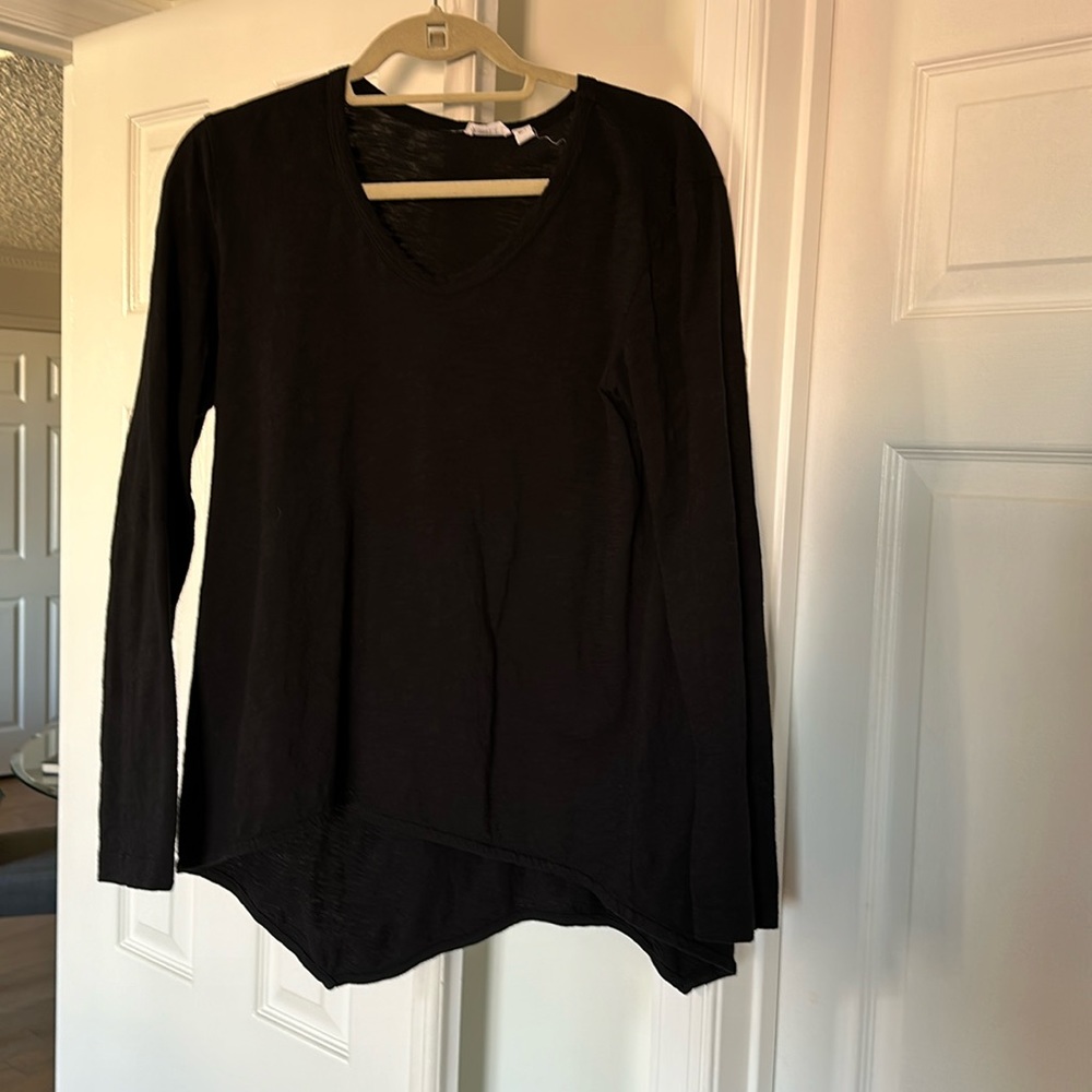 Wilt long sleeve shirt, longer in the back. Great with leggings or skinny jeans